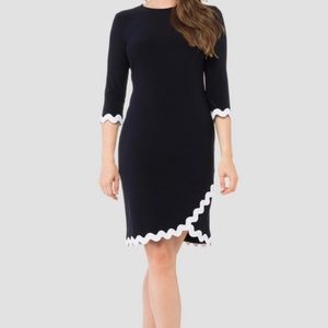By designer Joseph Ribcoff, black dress 3/4 sleeve, white wavy rip rap trim